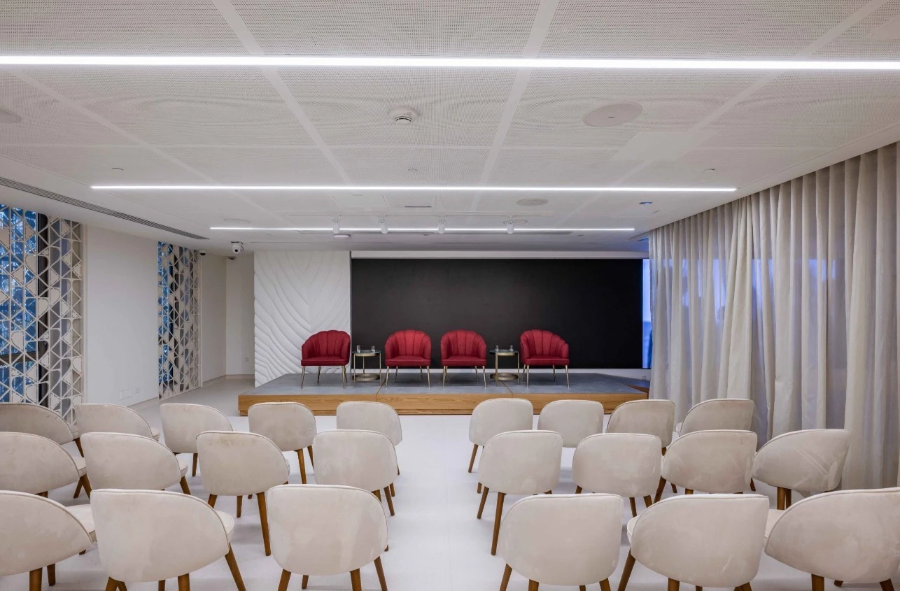 Expo City Dubai Women's Pavilion Majlis seating area with stage.