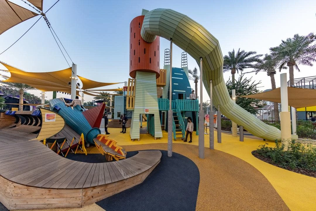 Colorful playground at Expo City Dubai with slides and structures.