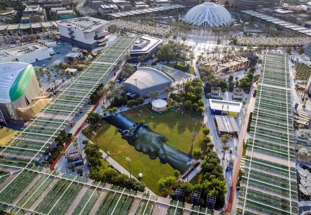 Aerial view of Expo City Dubai's Al Forsan Park, lush greenery.
