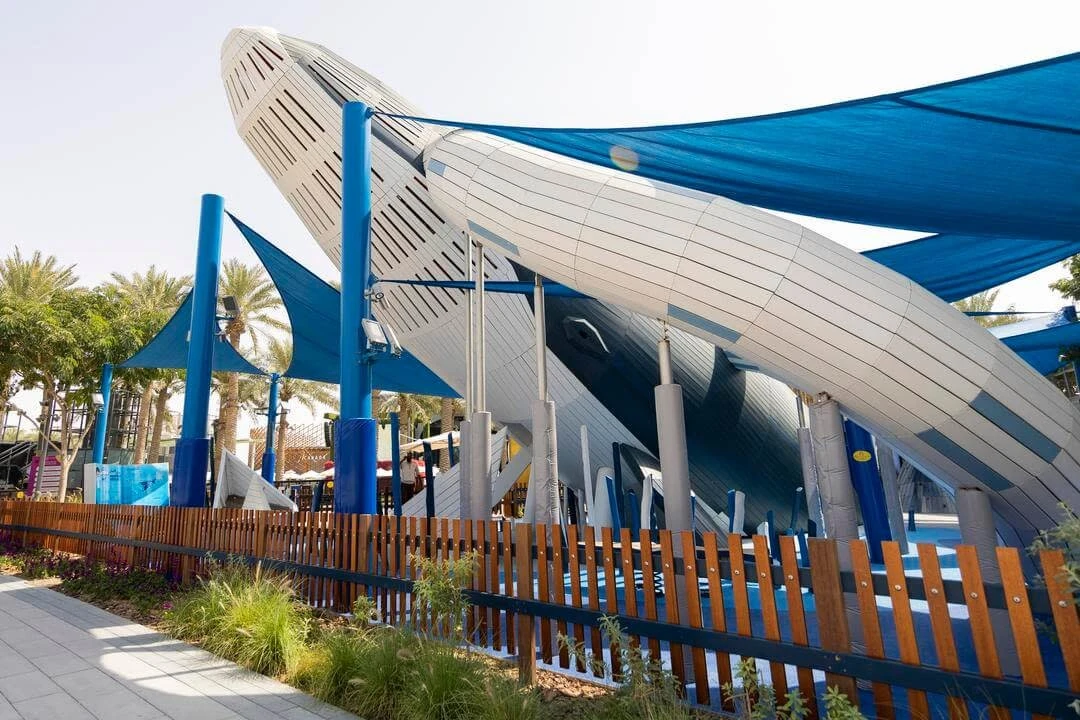 Expo City Dubai playground with blue shades and whale structure.