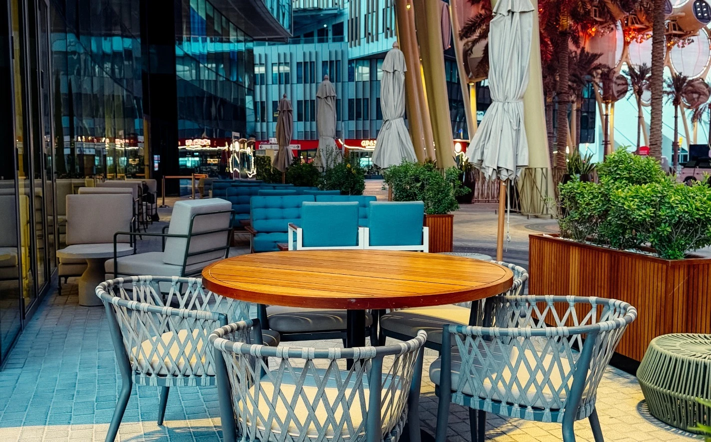Outdoor seating at Expo City Dubai with modern chairs and tables.