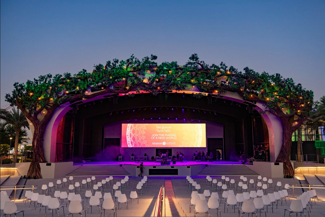 Expo City Dubai stage at Al Forsan Park, evening setup.
