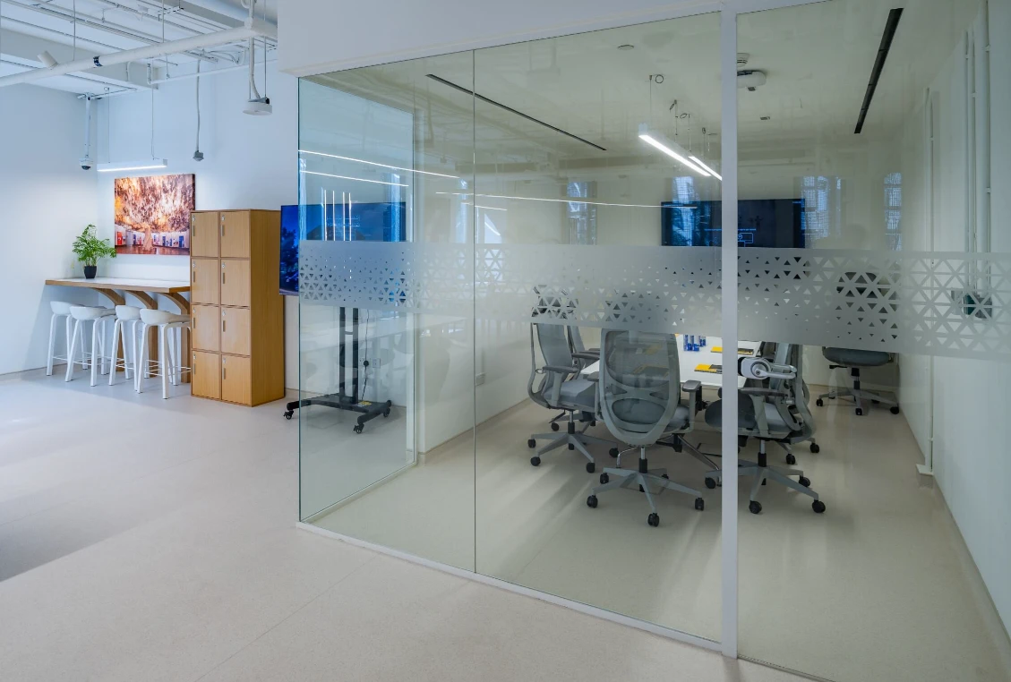 Modern meeting room at Expo City Dubai with glass walls.