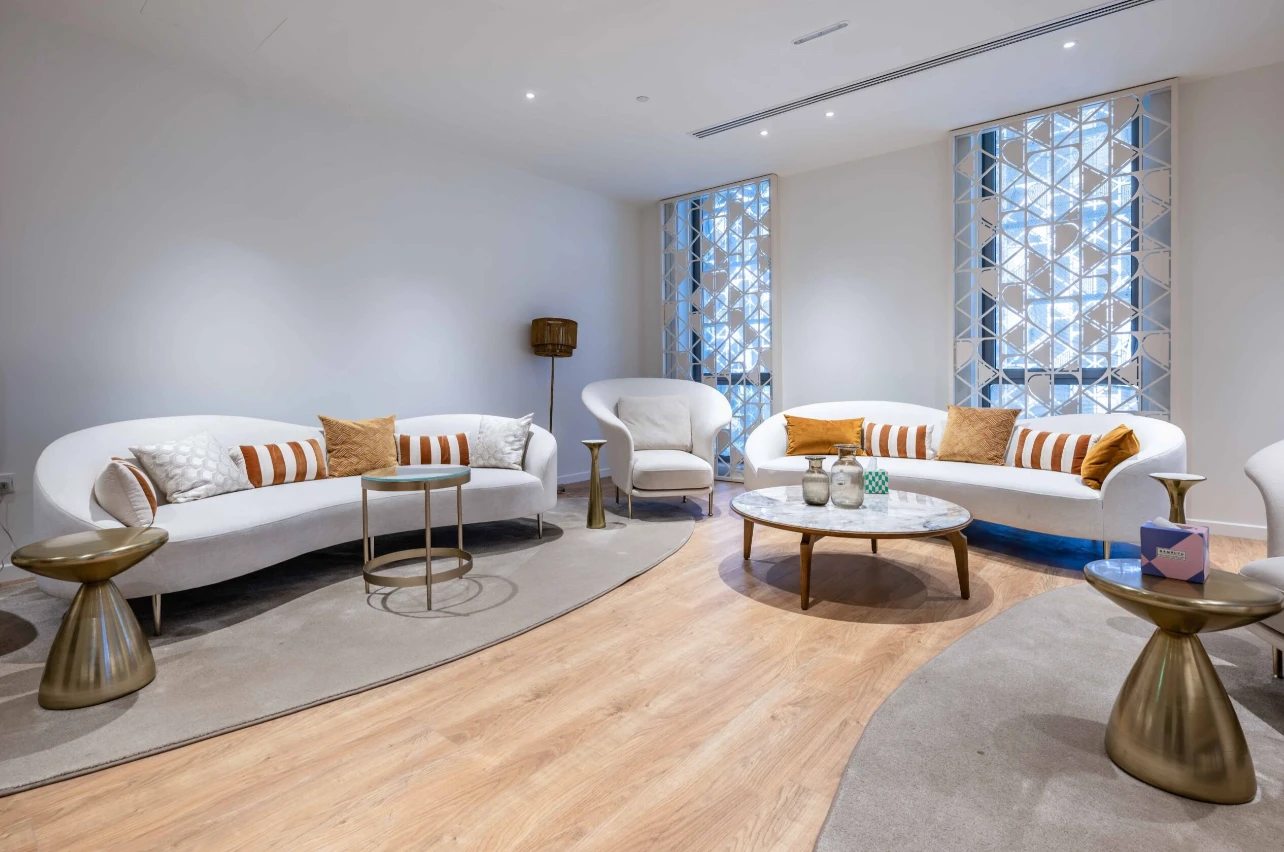 Modern lounge area at Expo City Dubai with white sofas.