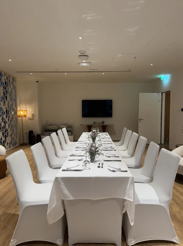 Elegant dining setup at Expo City Dubai conference room.