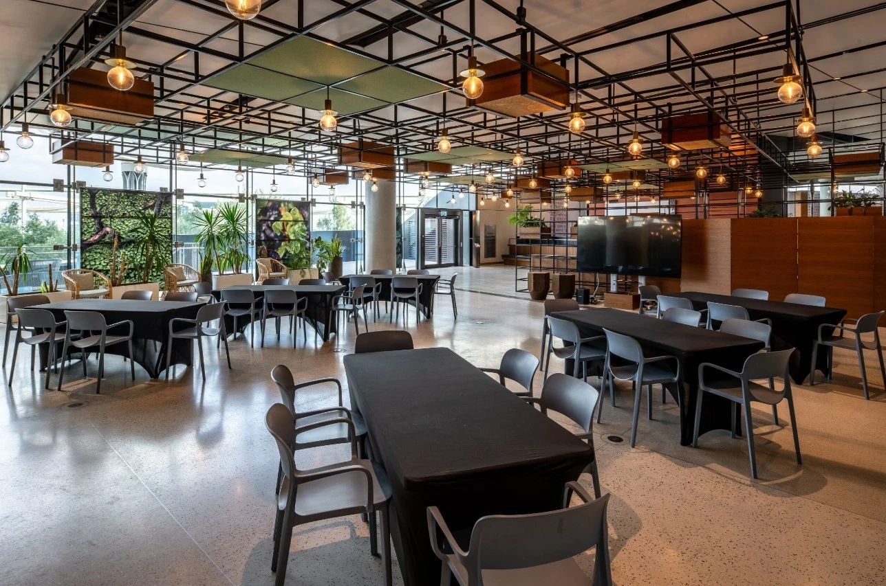 Expo City Dubai Terra Wonder Lab with tables and chairs setup.