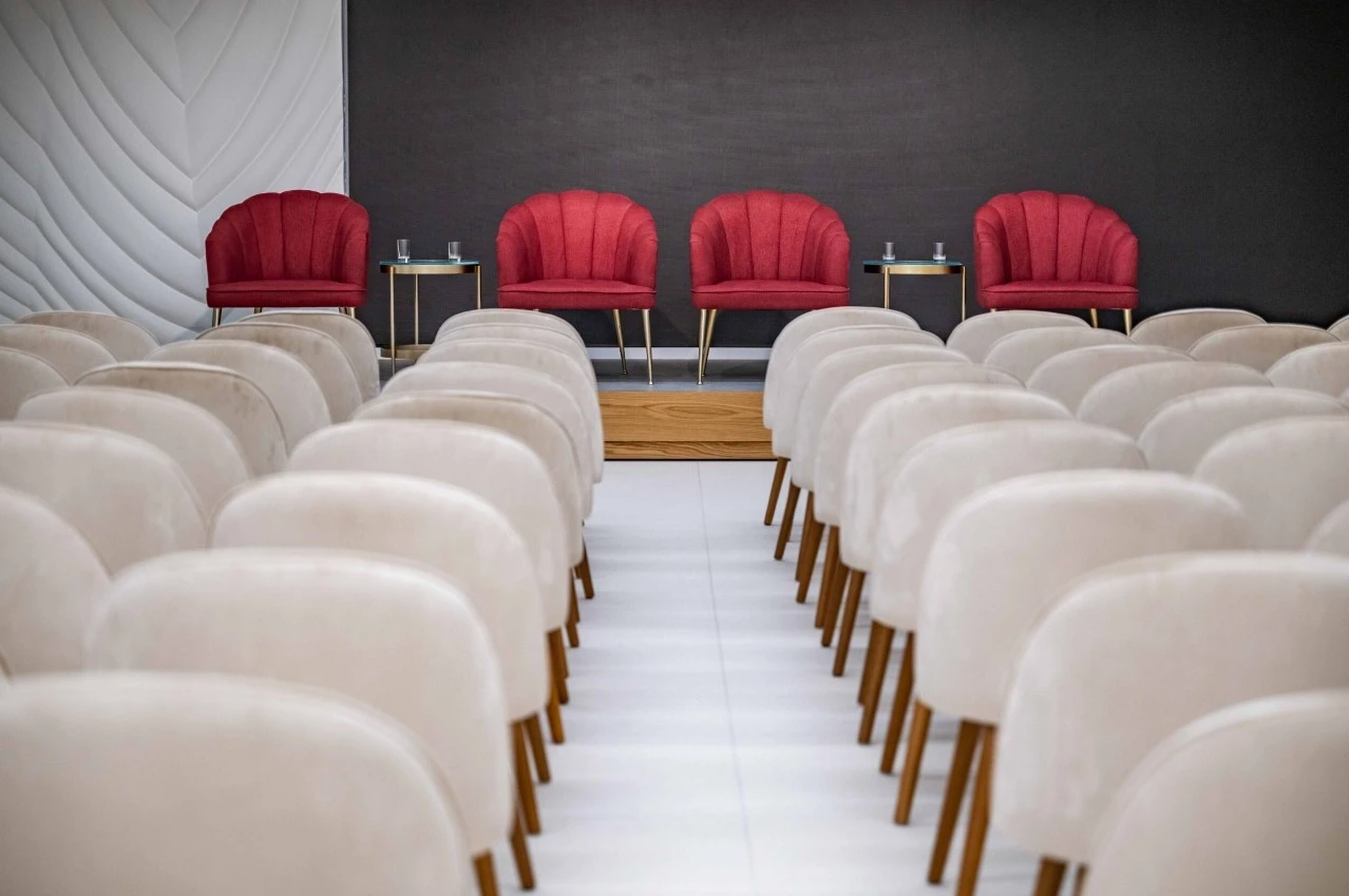 Women's Pavilion Majlis seating, Expo City Dubai, with red chairs.