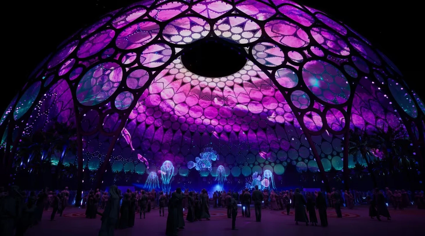 Al Wasl Plaza illuminated in purple, Expo City Dubai at night.