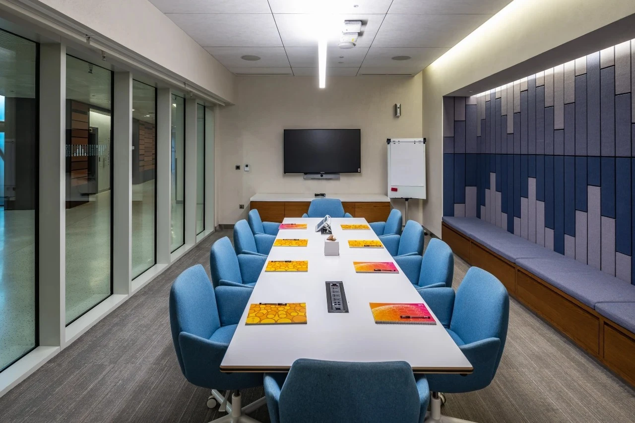 Modern conference room at Expo City Dubai with blue chairs.