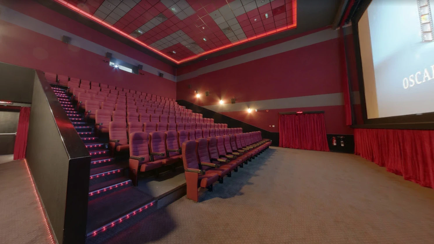 Empty theater with red seats at Star Cinema, Al Foah Mall, Abu Dhabi.