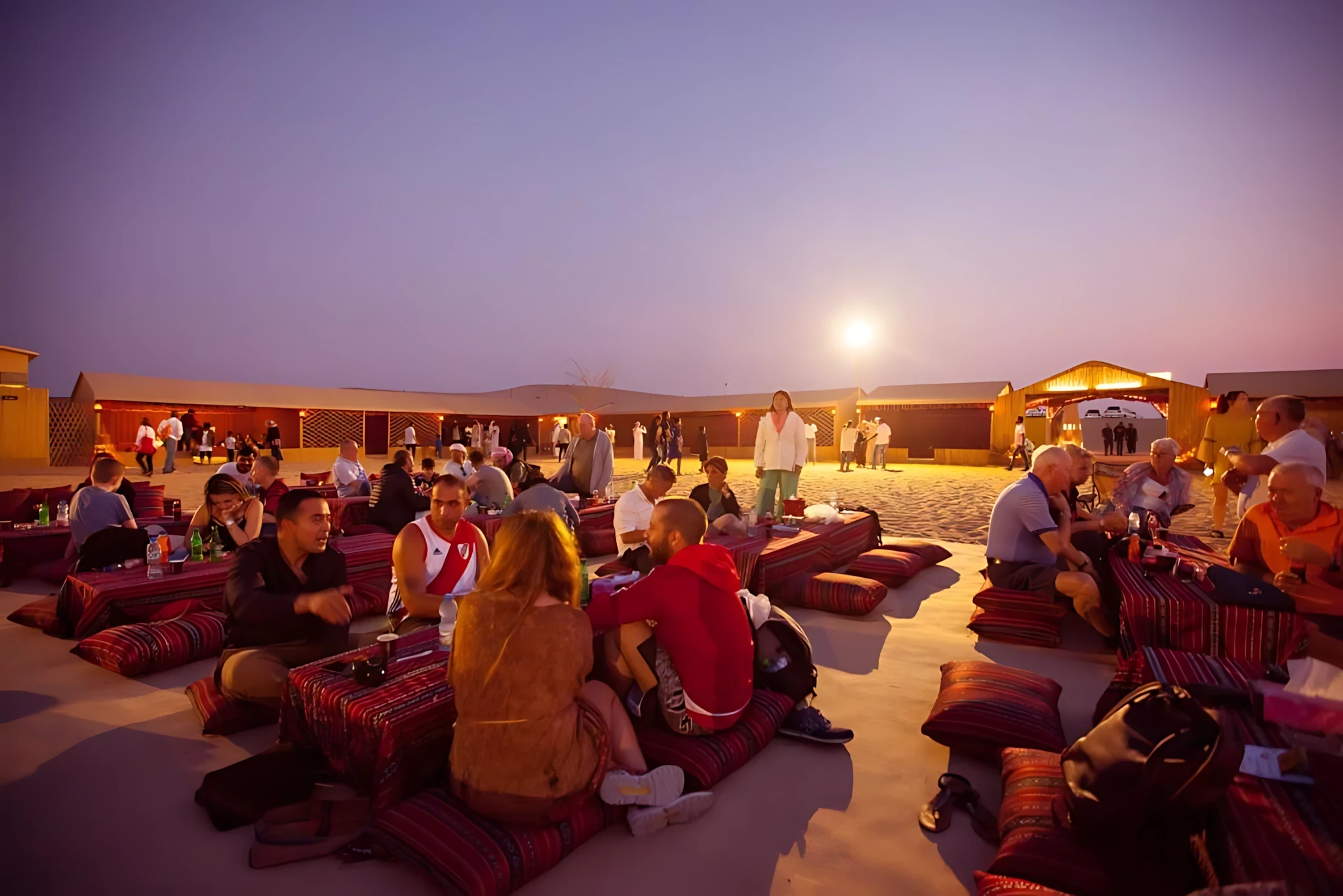 People enjoying evening at Al Khatim Desert Safari, Abu Dhabi.