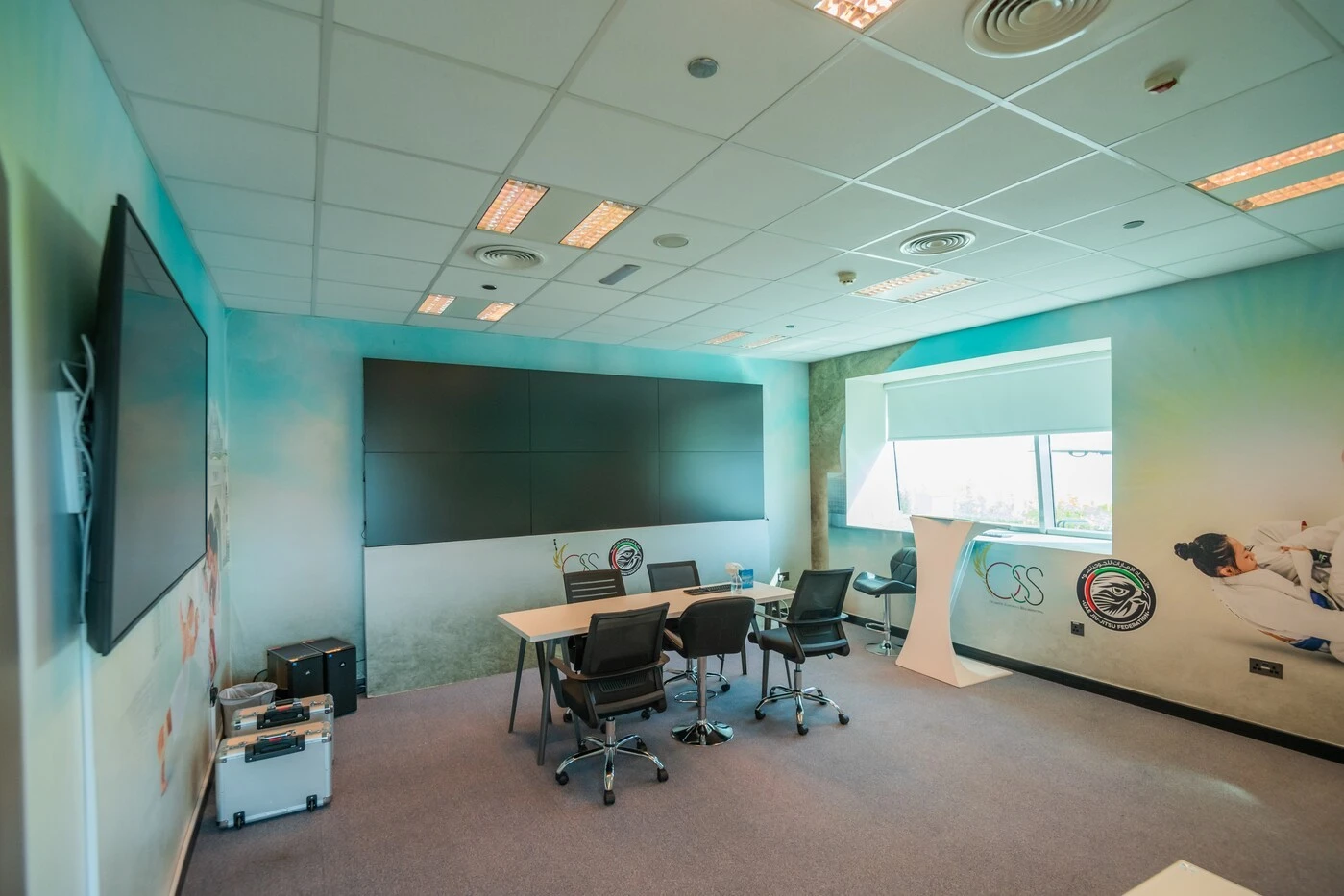Meeting room at Mubadala Arena, Abu Dhabi, with conference table.