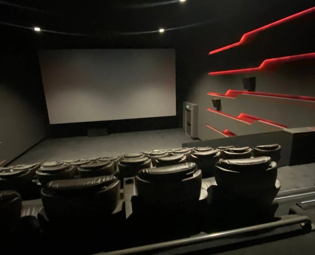 Empty theater with red accents, Empire Cinema Al Ahsa Al Hofuf.