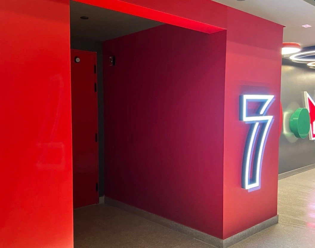 Red hallway with neon number seven, Empire Cinema Al Hofuf.