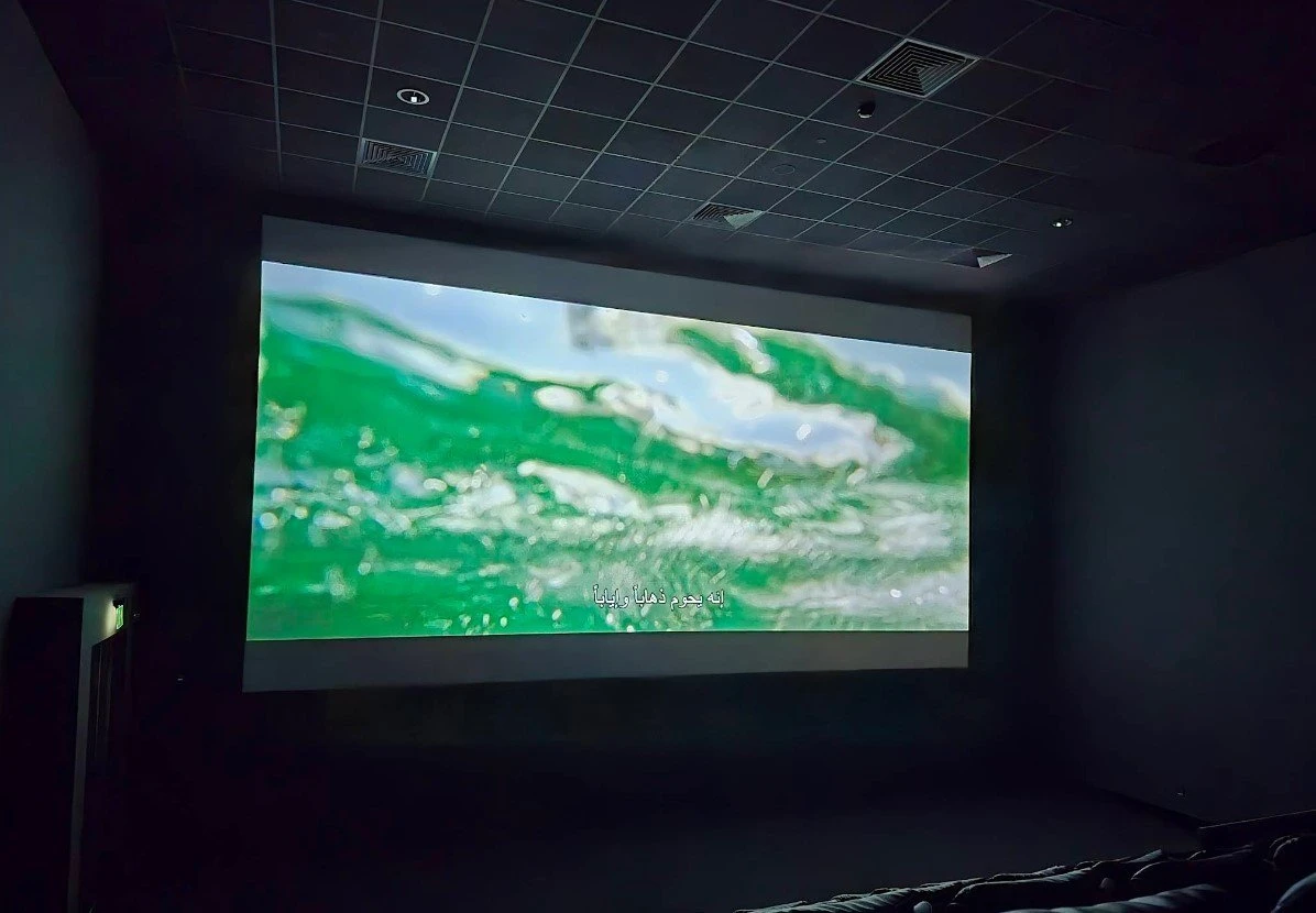 Empire Cinema Al Ahsa Al Hofuf screen showing green ocean waves.