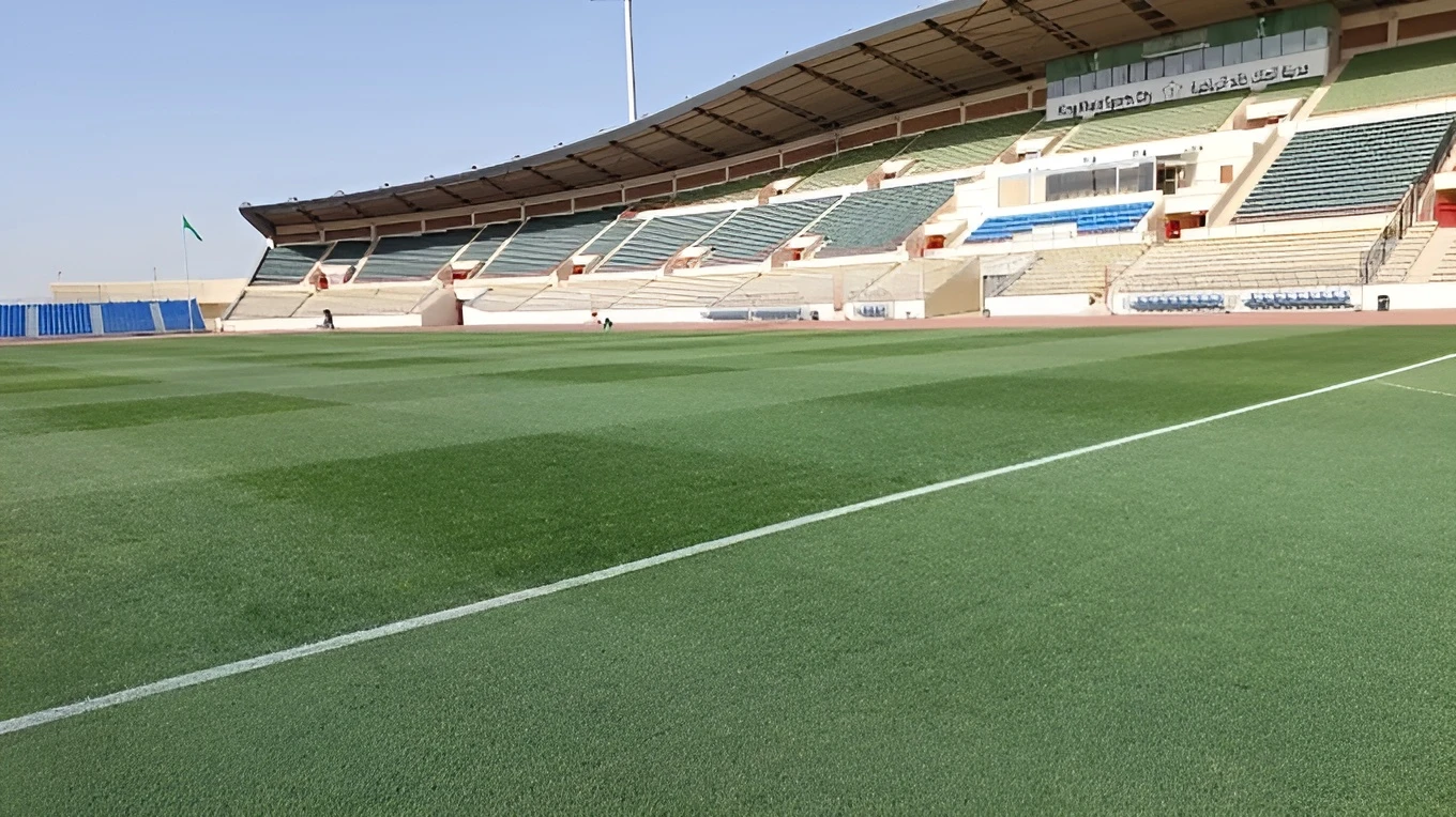 King Khalid Sport City Stadium, green field, empty stands, Tabuk.