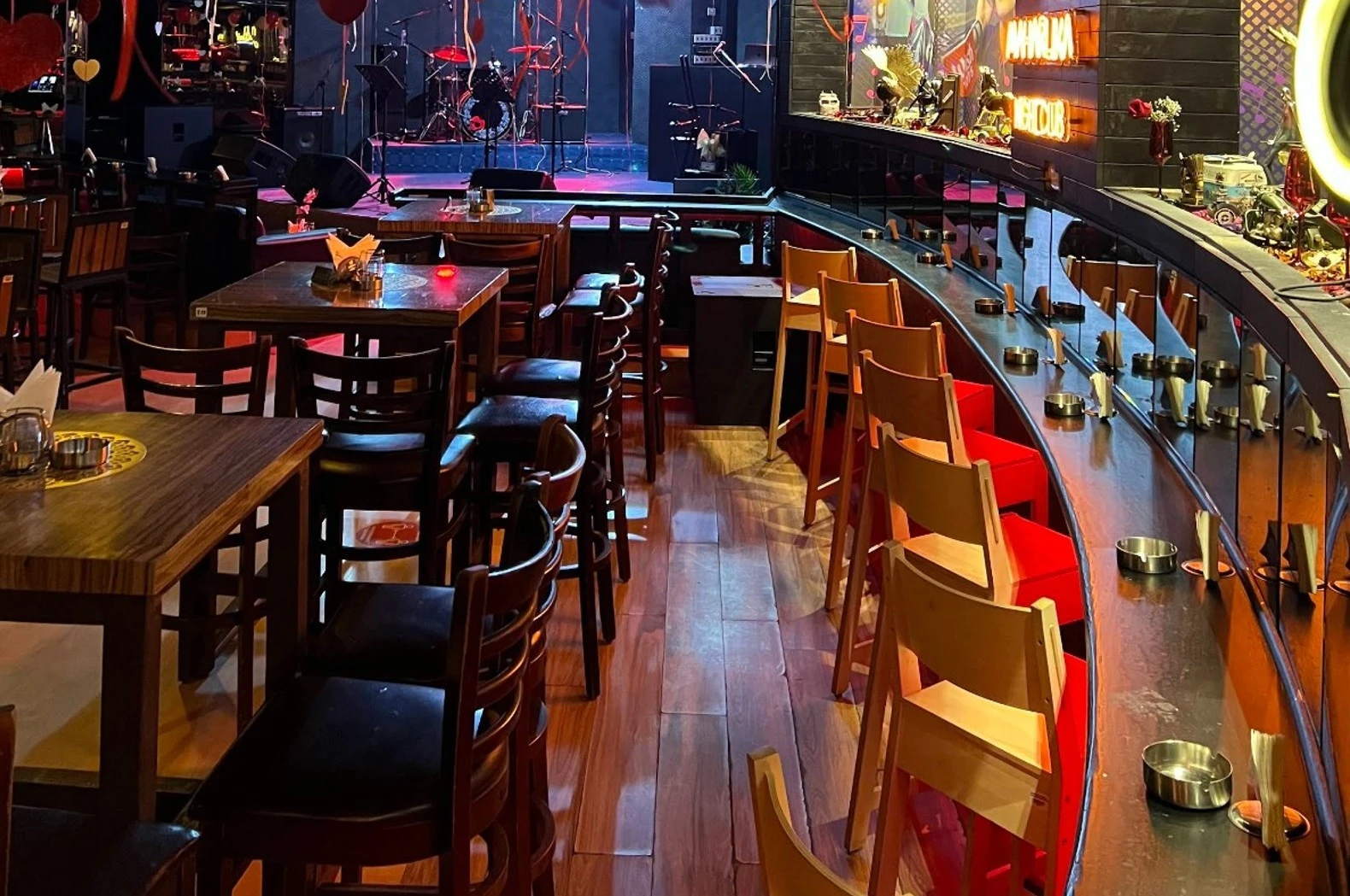 Maharlika Night Club Doha interior with stage and seating area.
