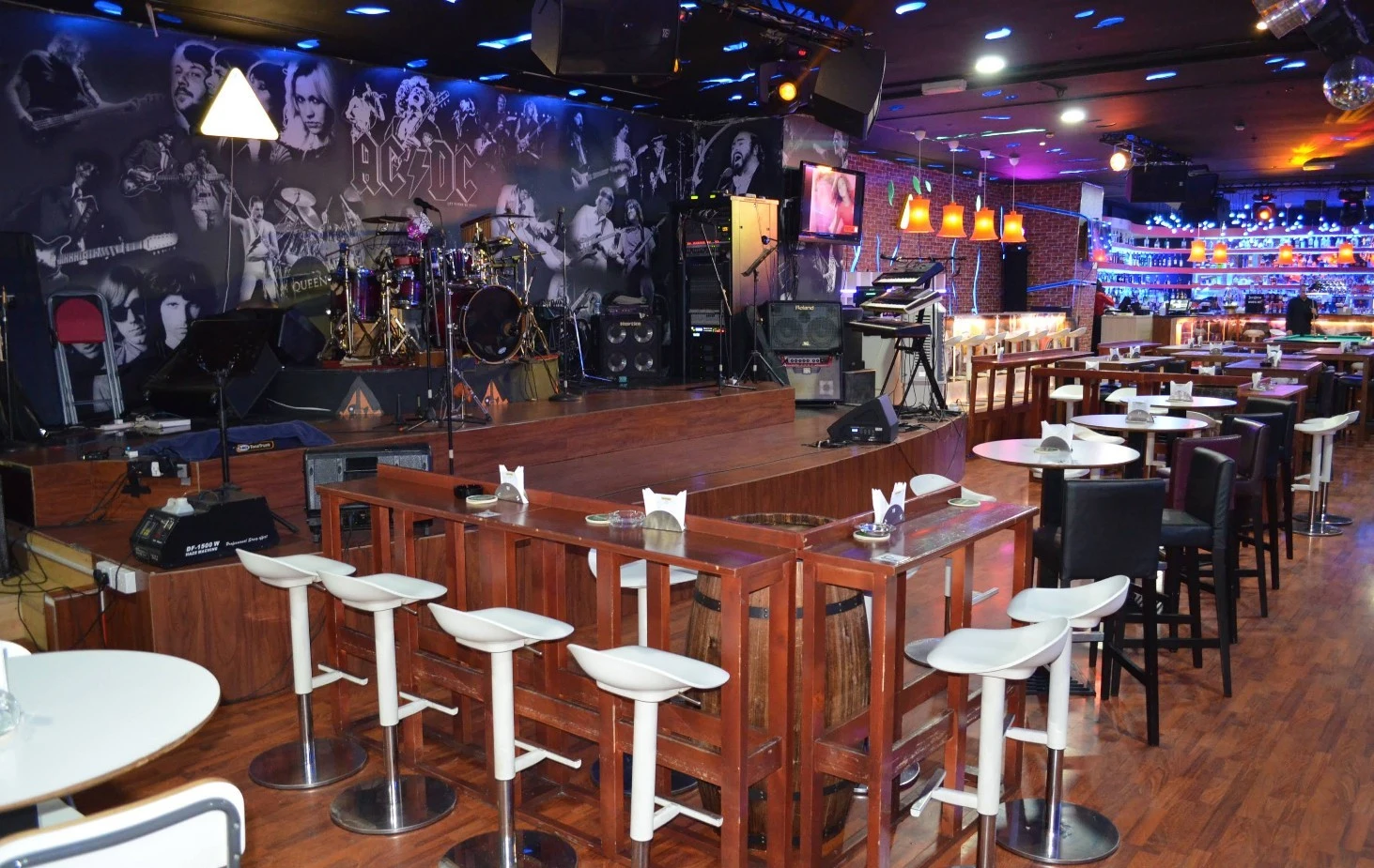 Krossroads Club Doha stage with instruments and seating area.