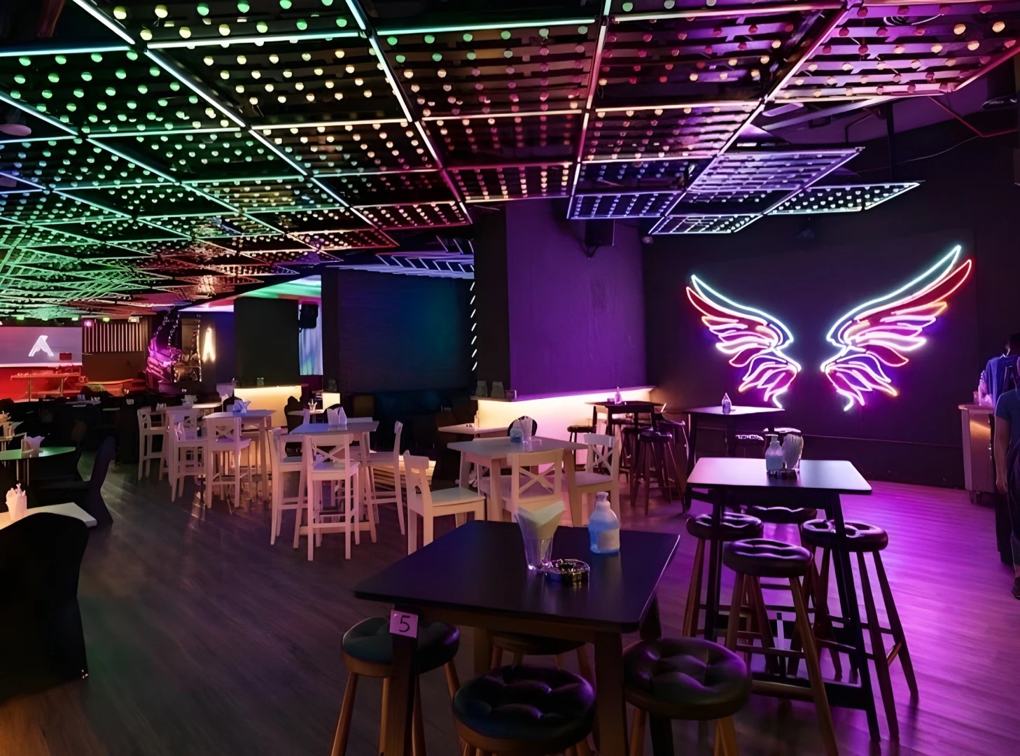Colorful interior of Matrix Club Qatar in Doha with neon lights.