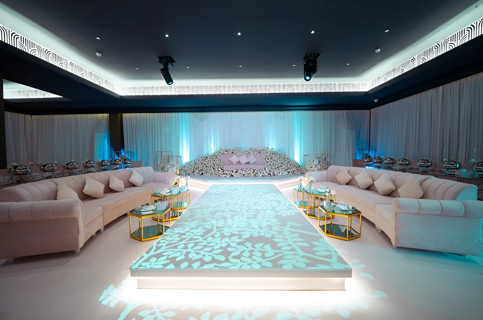Elegant event setup at U Venue Doha with floral decorations.
