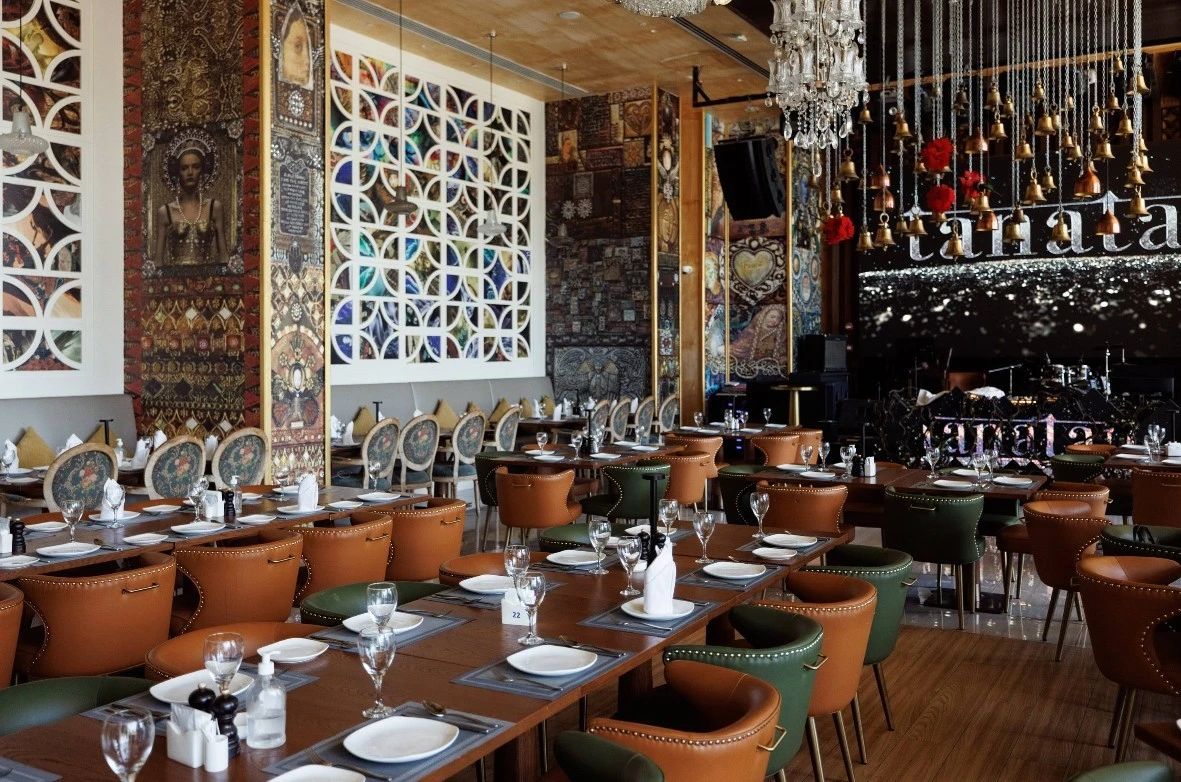 Elegant dining area at Tanatan Dubai with artistic decor.