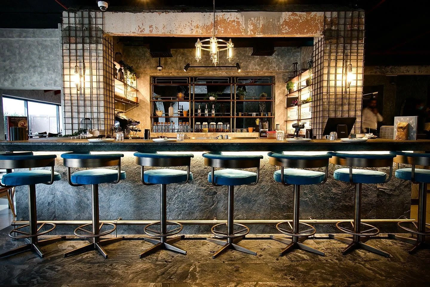 Stylish bar interior at 11 Woodfire Restaurant, Dubai.