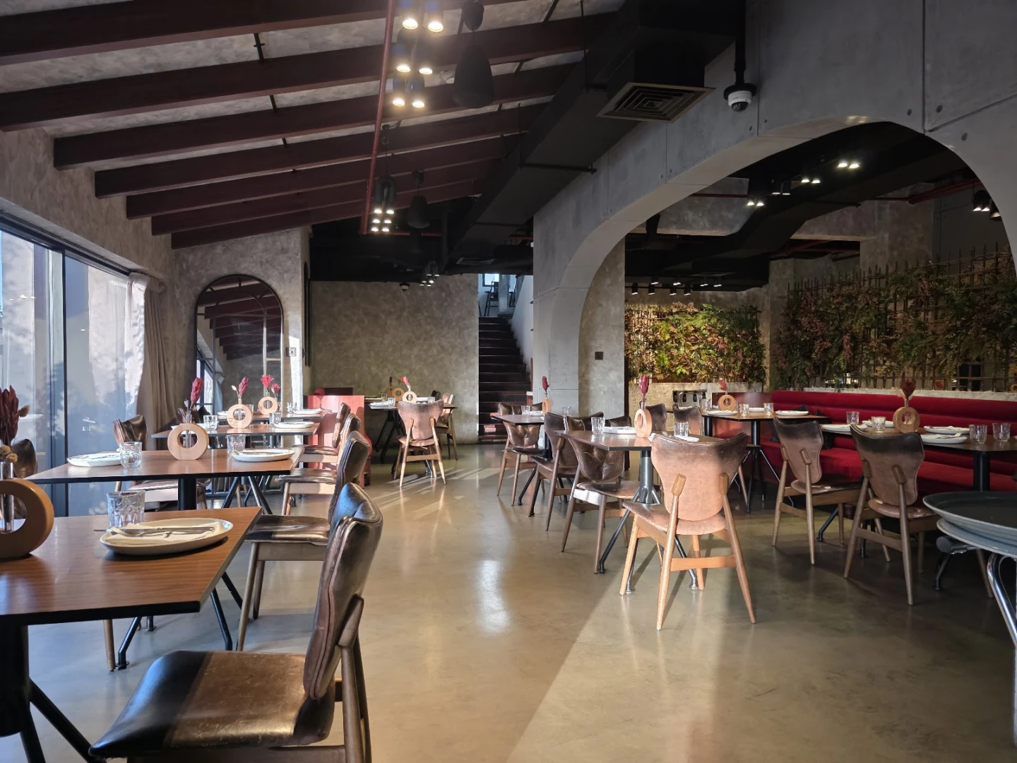 Elegant interior of 11 Woodfire Restaurant, Dubai, with stylish seating.