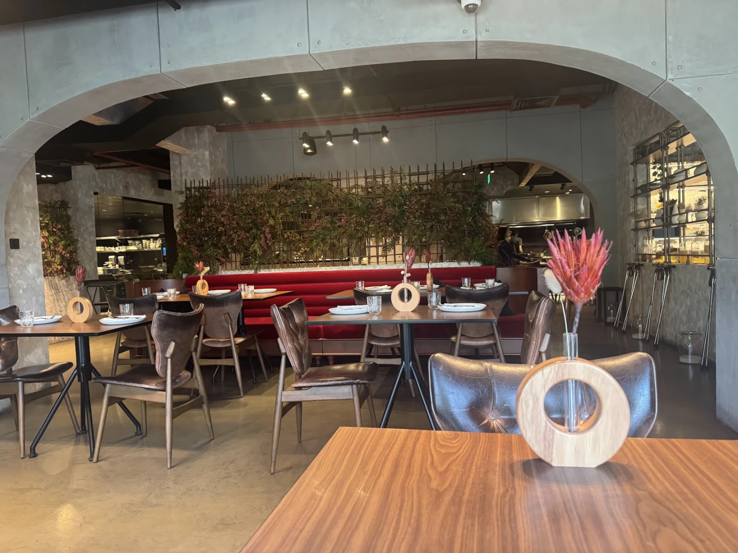 Elegant interior of 11 Woodfire Restaurant, Dubai, with modern decor.