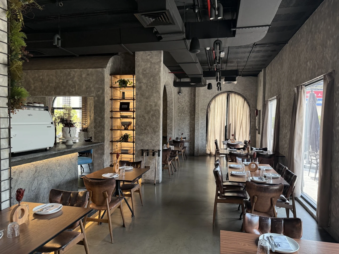 Elegant dining area at 11 Woodfire Restaurant, Dubai.