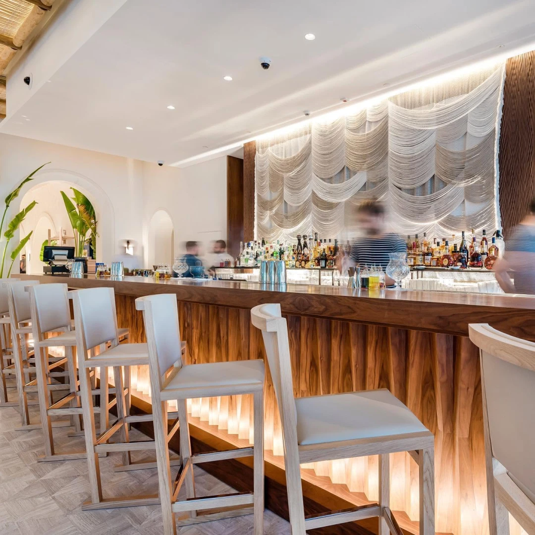 Elegant bar interior at Nammos Dubai with modern decor.
