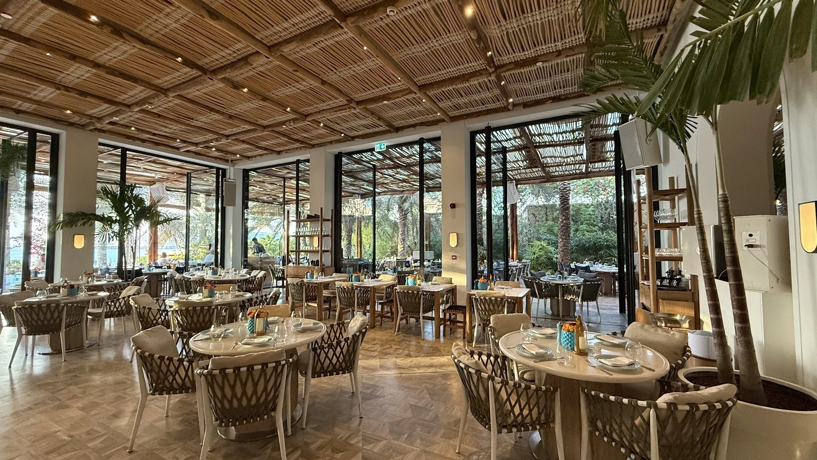 Elegant dining area at Nammos Dubai with natural light and decor.