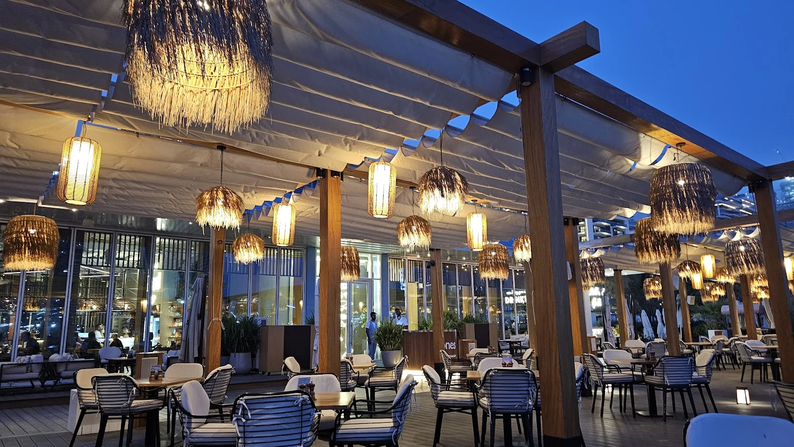 Elegant outdoor seating at Jones the Grocer The Palm Jumeirah, Dubai.