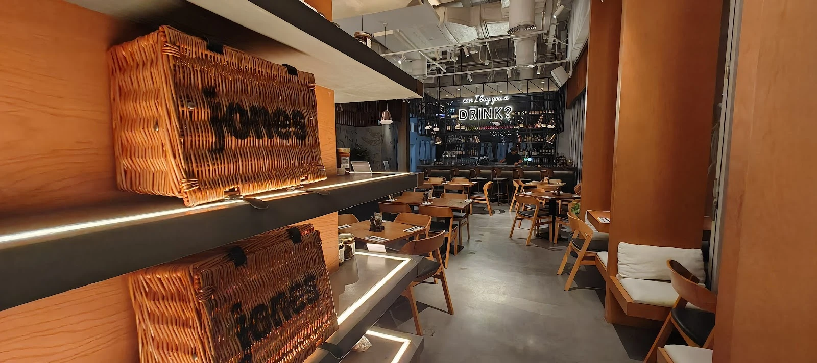 Jones the Grocer Dubai, elegant dining area with wooden decor.