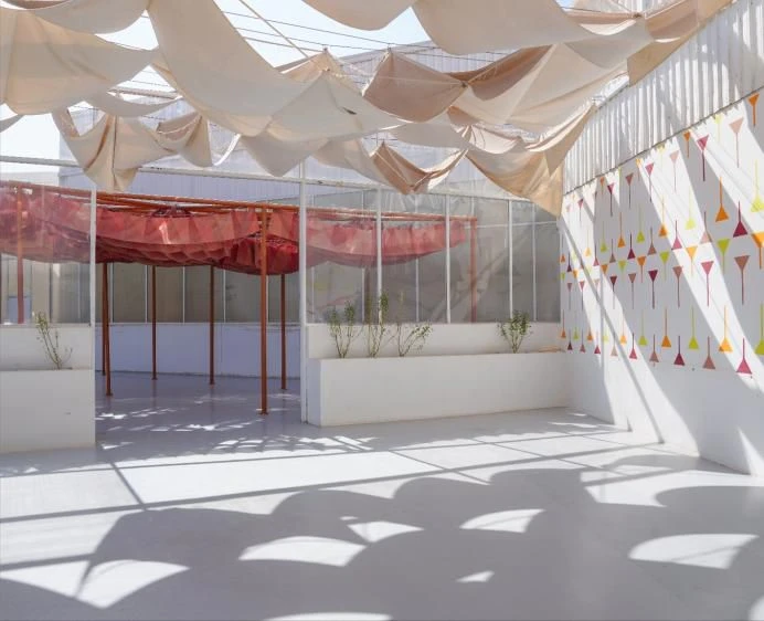 Jax District Riyadh venue with colorful draped fabric and geometric patterns.