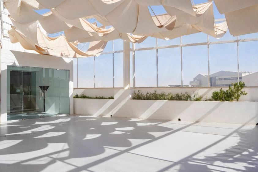 Jax District Riyadh venue with glass walls and fabric ceiling.