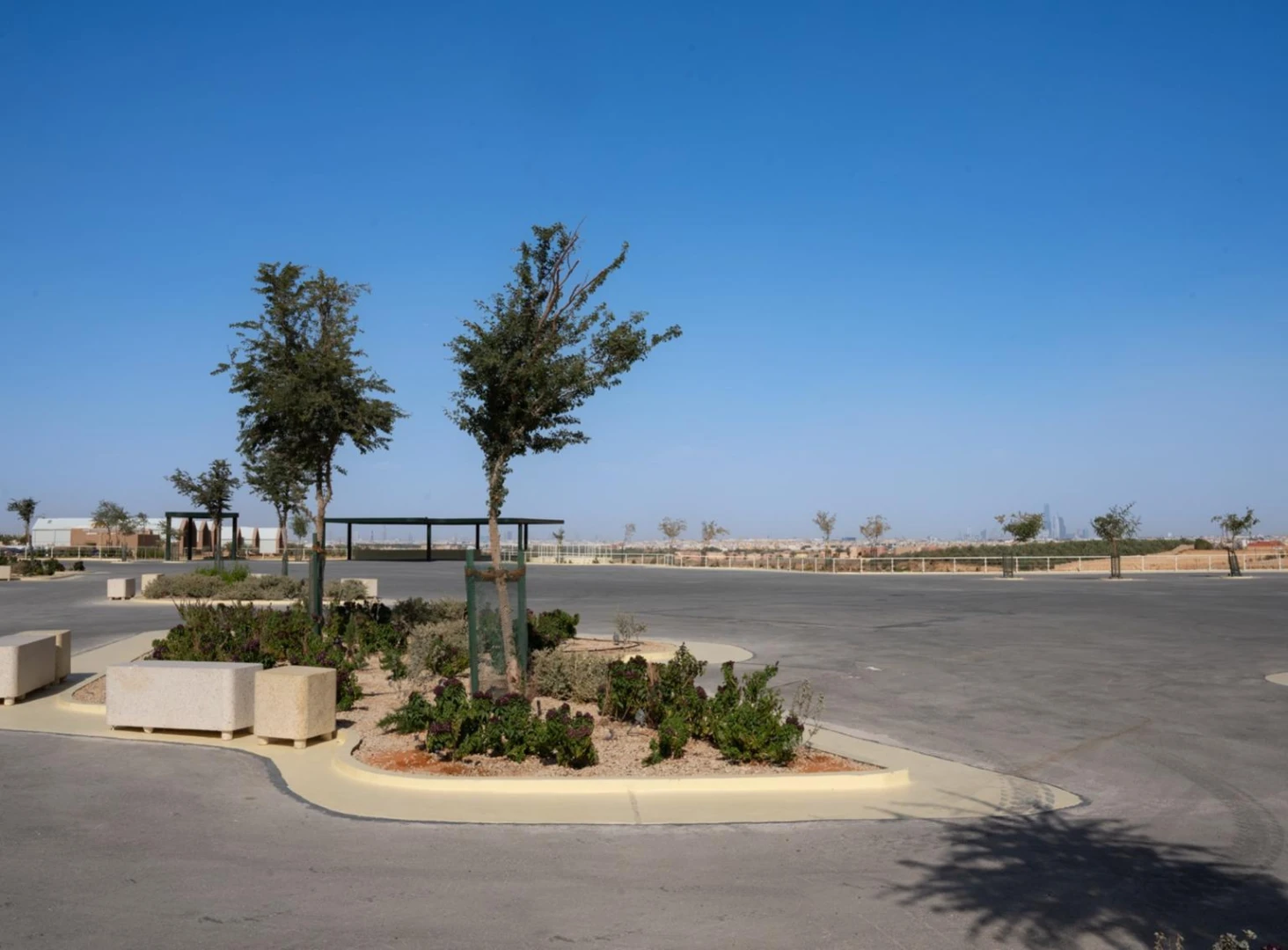 Jax District Riyadh exterior with trees and open space, Dubai.