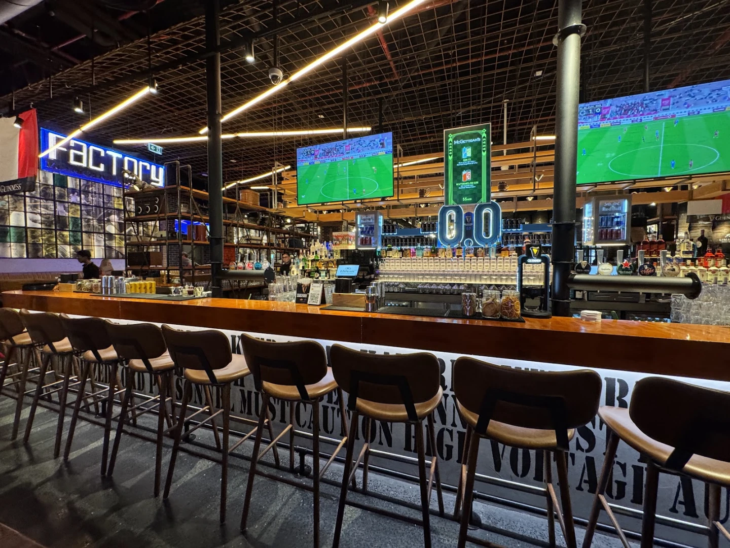 McGettigan's Factory The Palm bar interior with seating, Dubai venue.