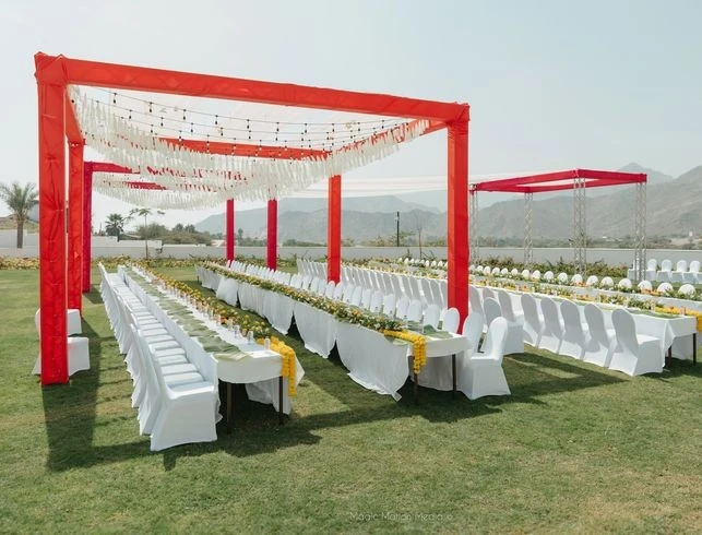 Outdoor event setup at Royal M Hotel, Dubai, with red canopy.