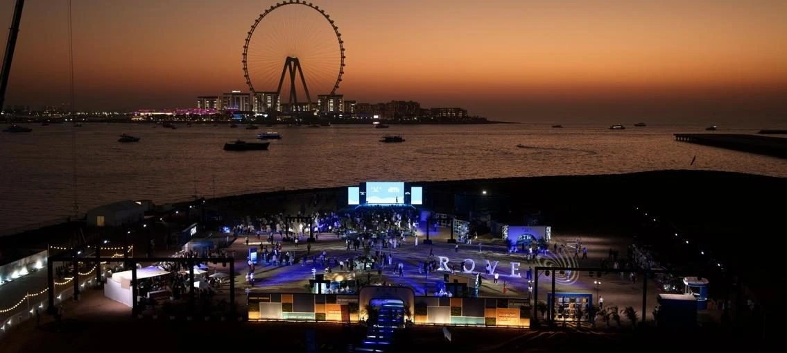 Evening event setup at Skydive Dubai, Dubai, UAE with Ferris wheel in background.