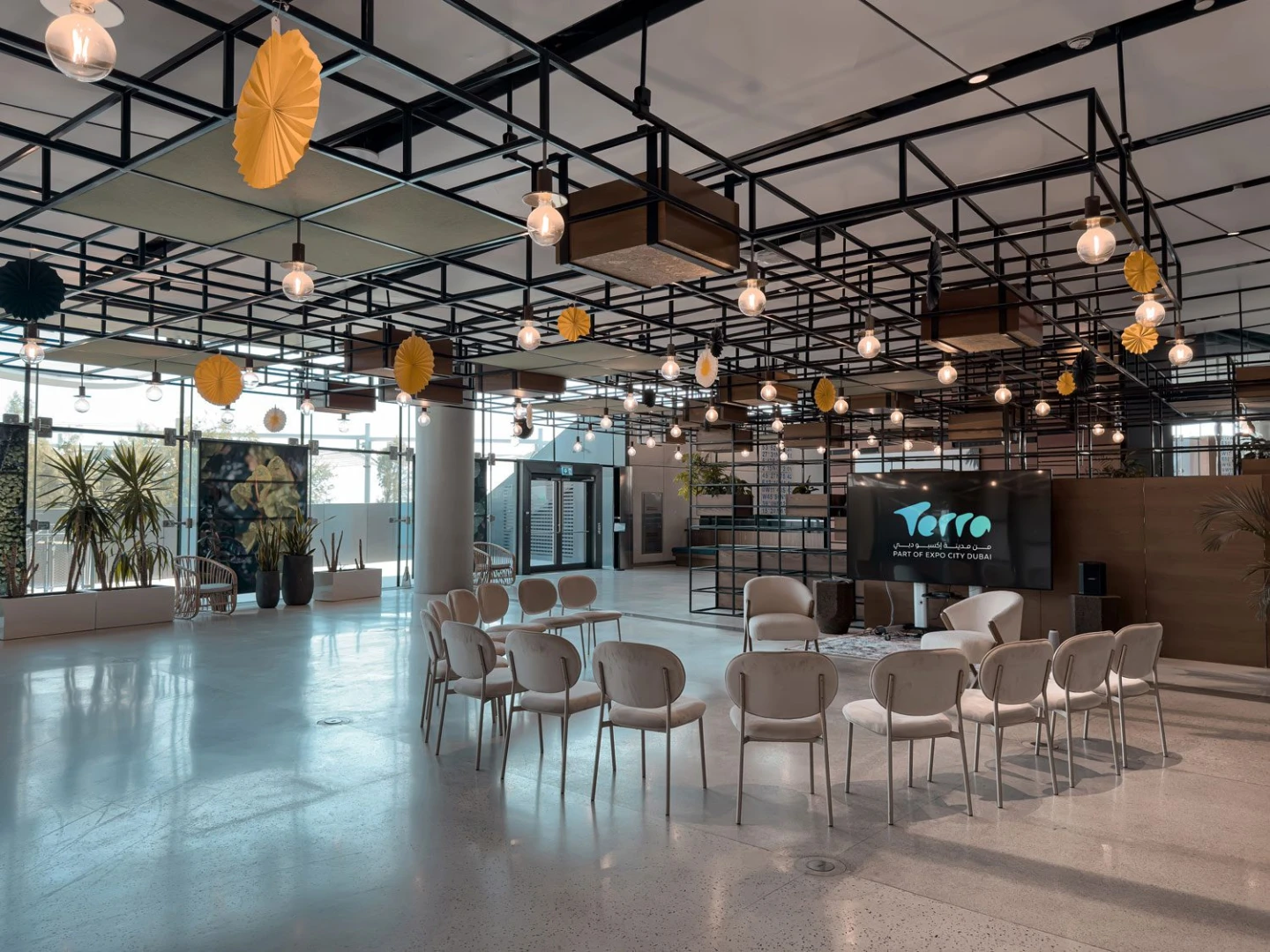 Modern event space with seating and decor at Terra, Expo City Dubai, UAE.