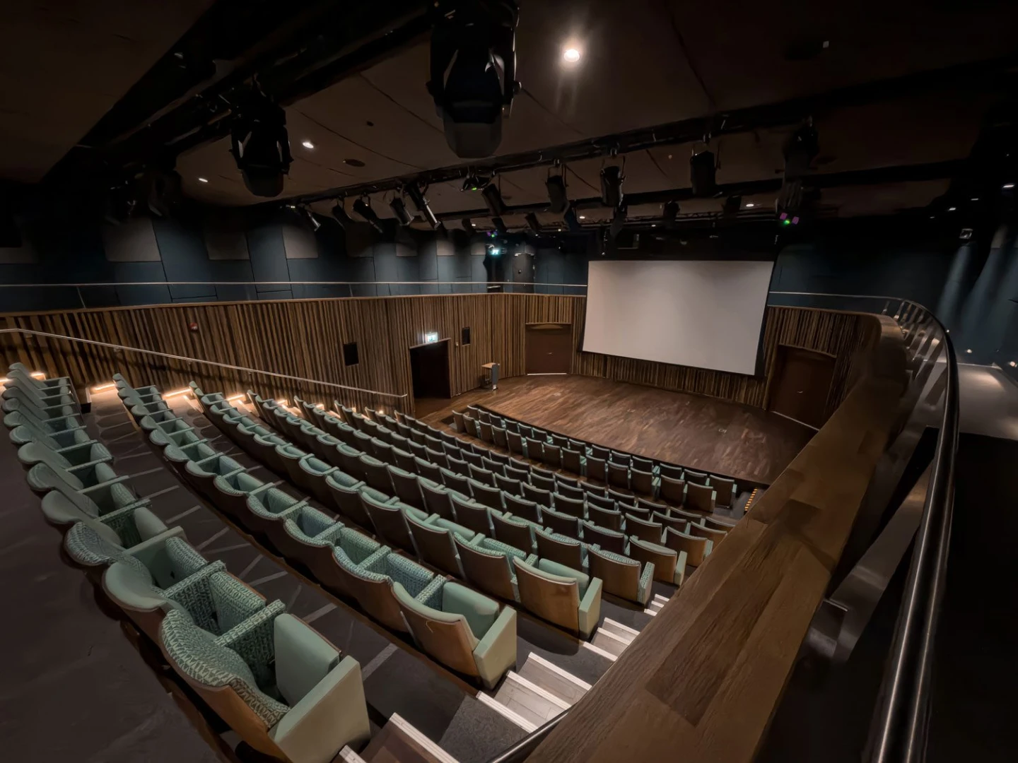 Auditorium with wooden stage and seating at Terra, Expo City Dubai, UAE