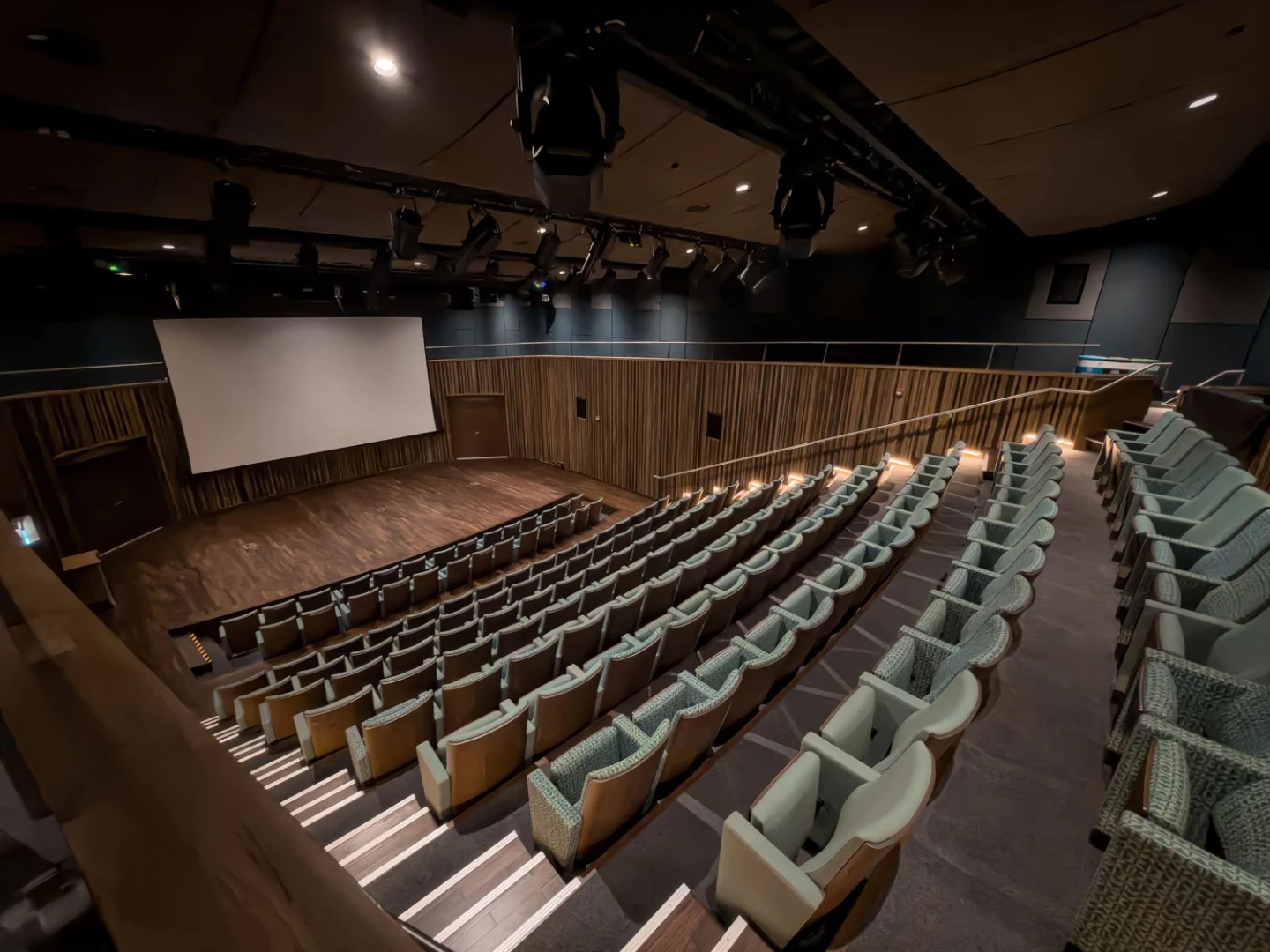 Auditorium with tiered seating and large screen at Terra, Expo City Dubai