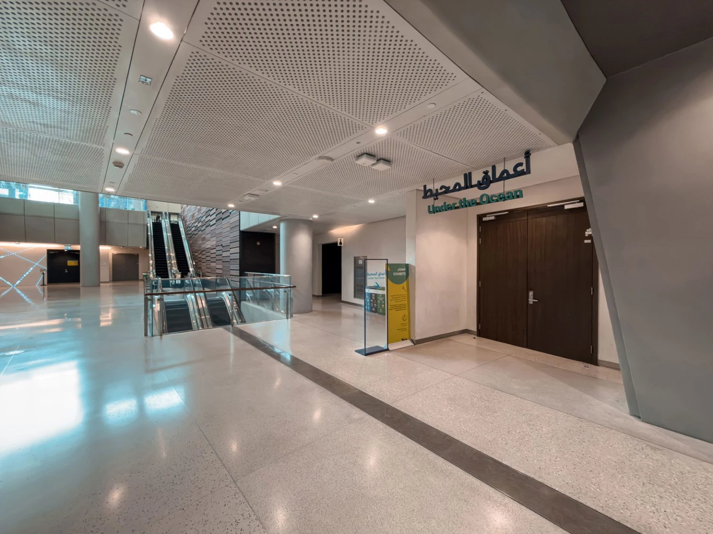 Spacious interior with escalators at Terra, Expo City Dubai, Dubai, UAE.