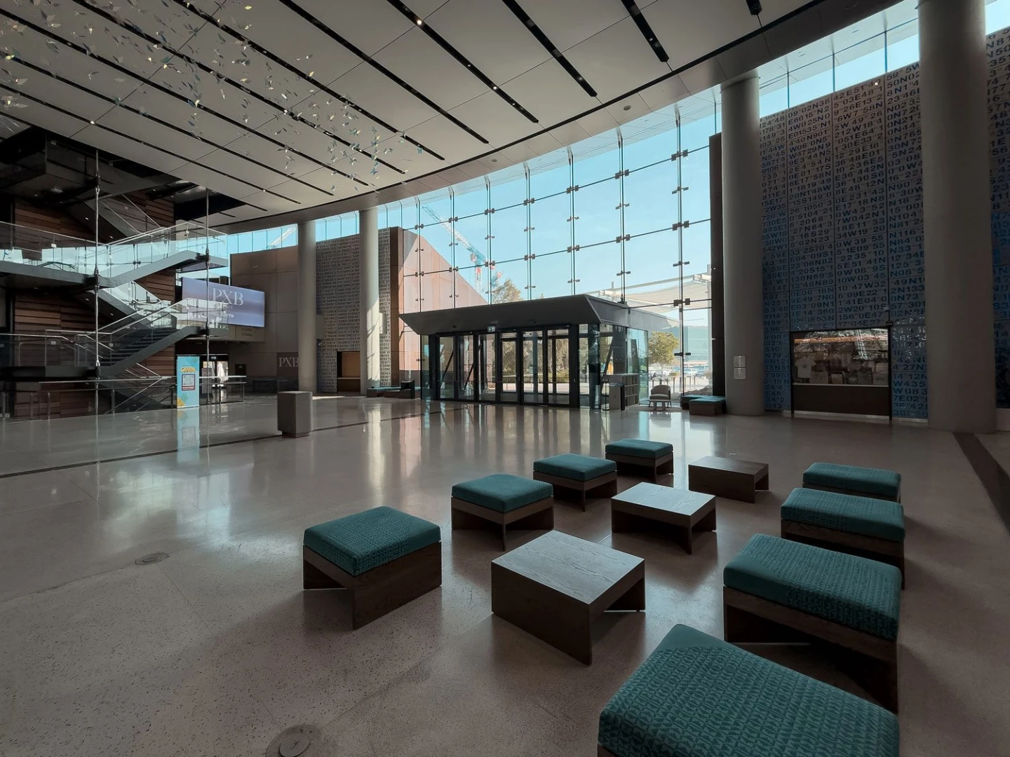 Spacious modern interior at Terra, Expo City Dubai, featuring seating and glass walls.