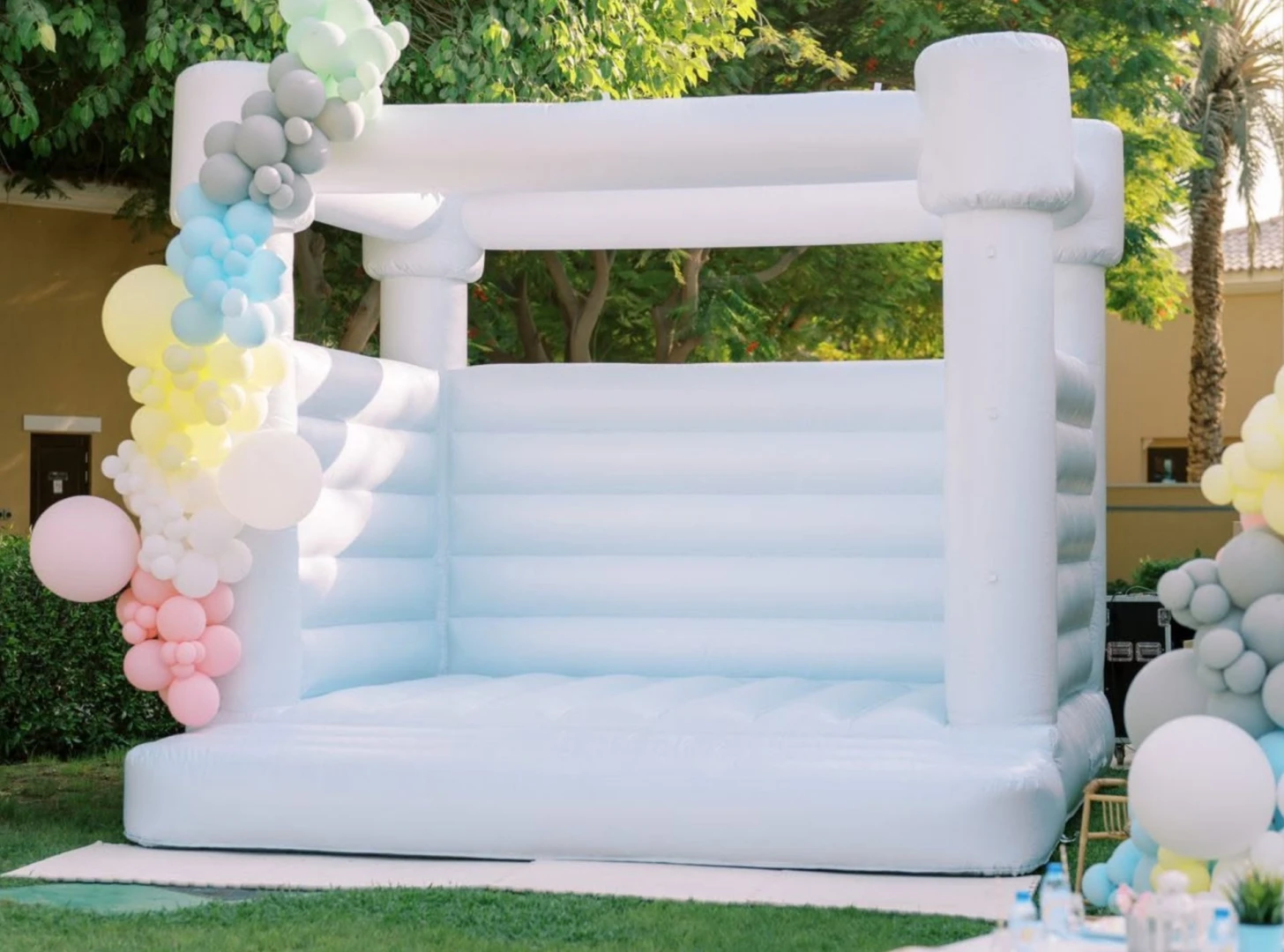 White inflatable structure with colorful balloons at Dubai Polo & Equestrian Club, Dubai.
