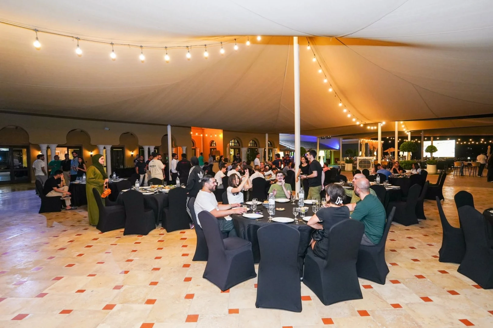 Guests seated under canopy at Dubai Polo & Equestrian Club, Dubai, UAE
