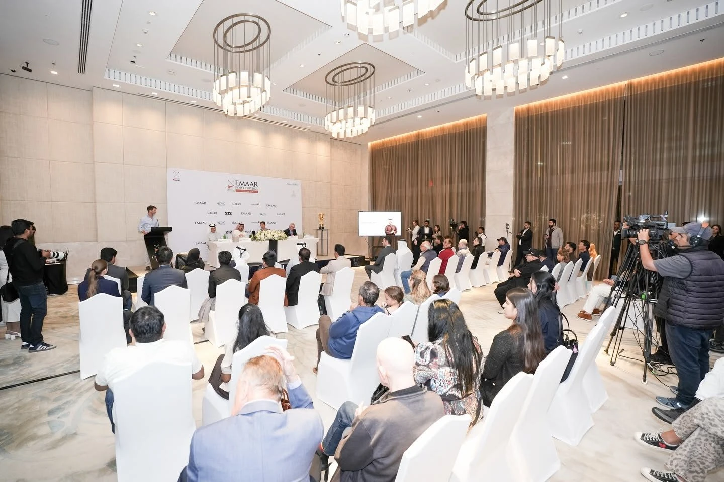 Conference setup with attendees at Dubai Polo & Equestrian Club, Dubai, UAE.
