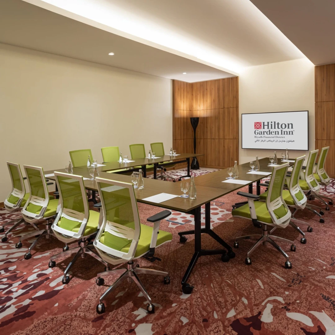 Conference room with green chairs at Hilton Garden Inn Riyadh Financial District, KSA.