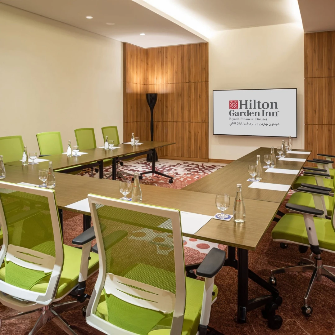 Conference room with green chairs at Hilton Garden Inn Riyadh Financial District, Riyadh.