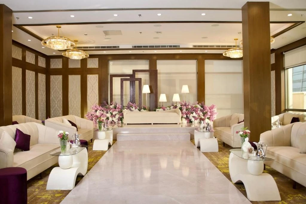 Elegant seating area with floral arrangements at Joudyan Olaya by Elaf, Riyadh, KSA.